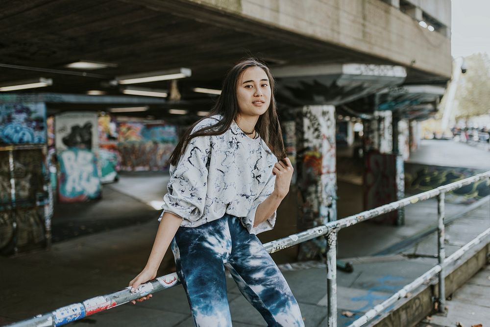 Cool Asian woman with marbled blue sweater