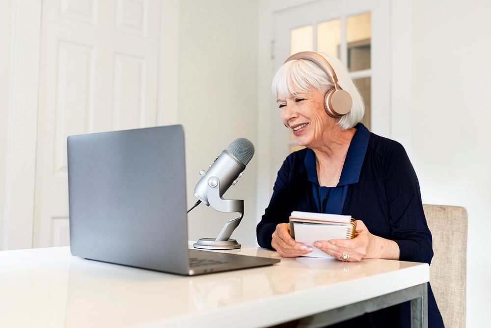 Successful woman hosting podcast streaming session at home