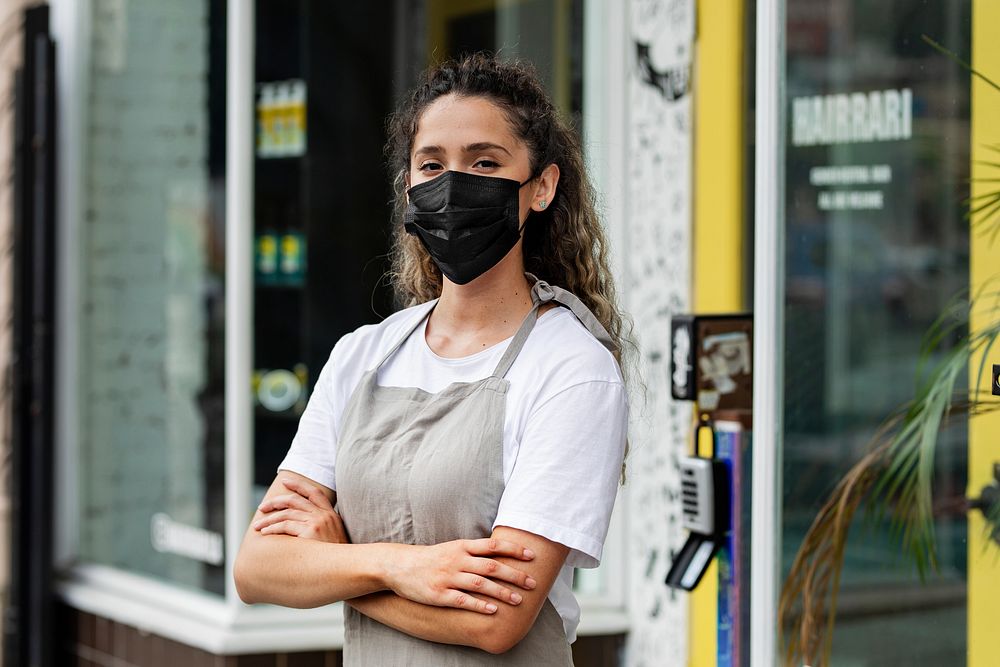 Cafe owner wearing face mask, the new normal lifestyle