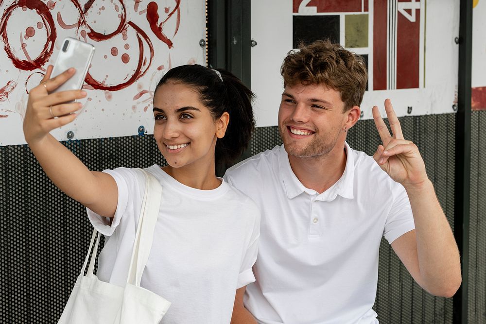 Couple taking selfie, minimal apparel fashion design