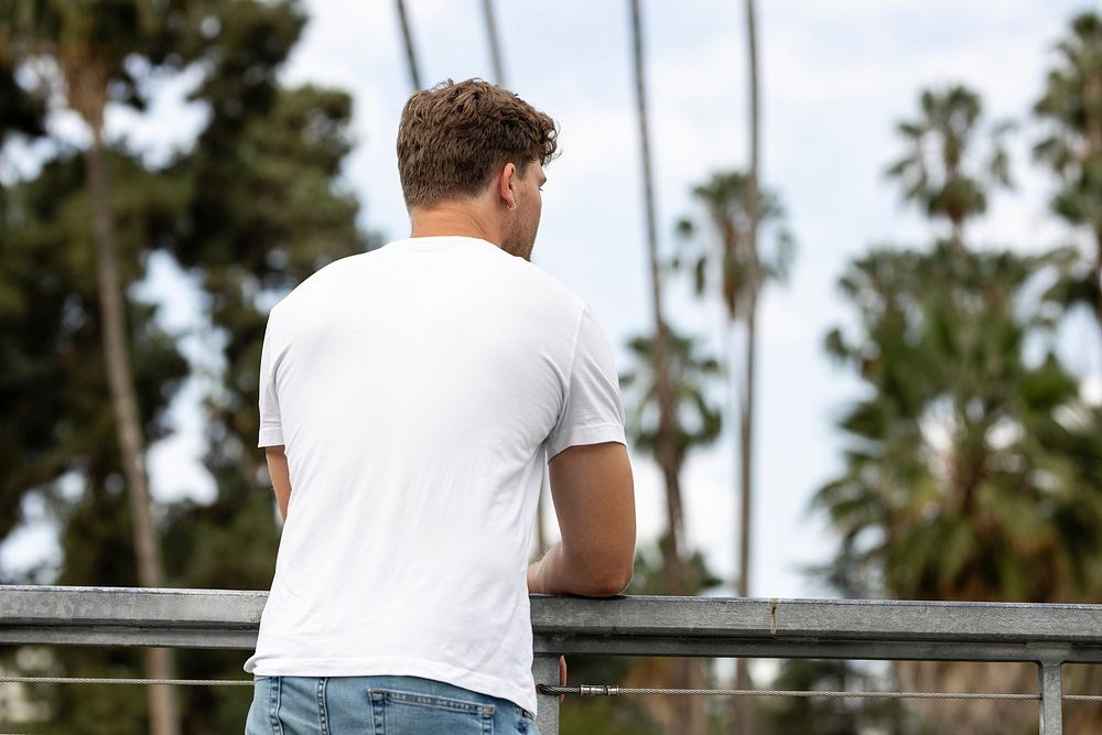 Man in white tee and jeans, summer outfit, rear view