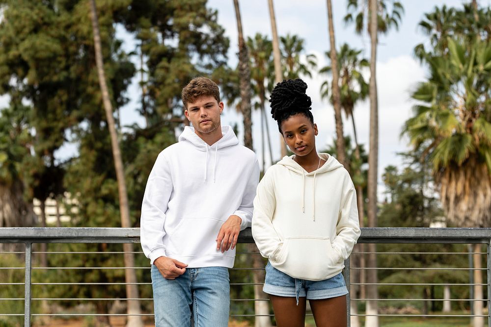 Couple in casual wear apparel, chilling in a park