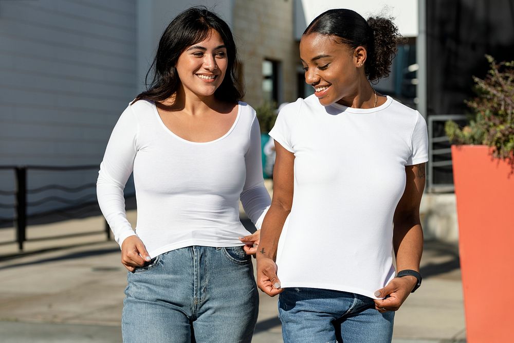 Women wearing plain white shirt, mixed race friends