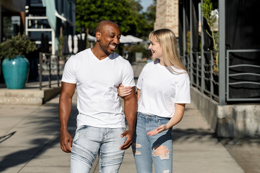 Happy couple enjoying a summer date, wearing plain white tee