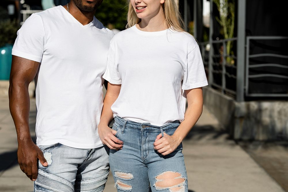 Couple enjoying dating in urban scene, wearing plain white shirts