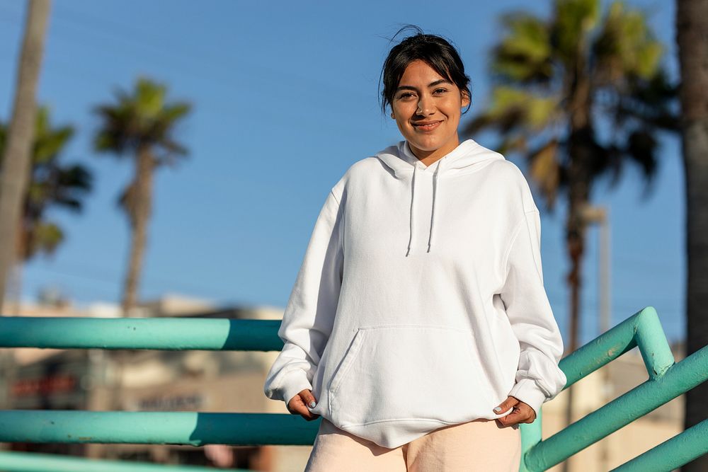 Woman wearing a streetwear hoodie, plain white design