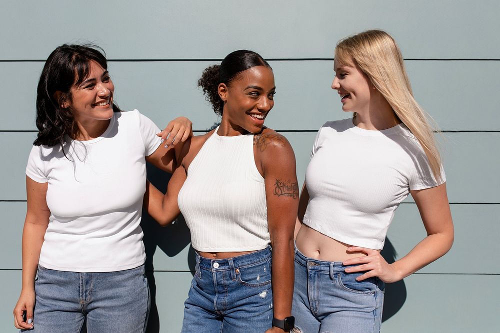 Beautiful mixed race women, three girlfriends wearing plain white tees