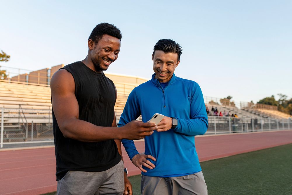 Two men looking at a phone