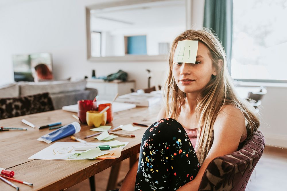 Girl with note paper on forehead, homeschooling in the new normal