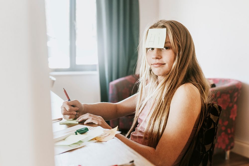 Girl with sticky note on forehead, homeschooling in the new normal