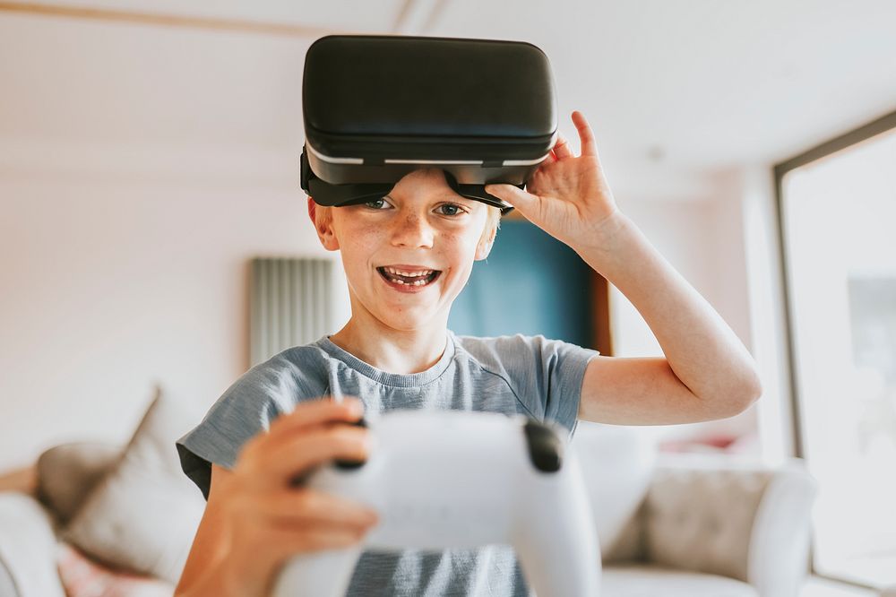 Young boy playing VR game at home
