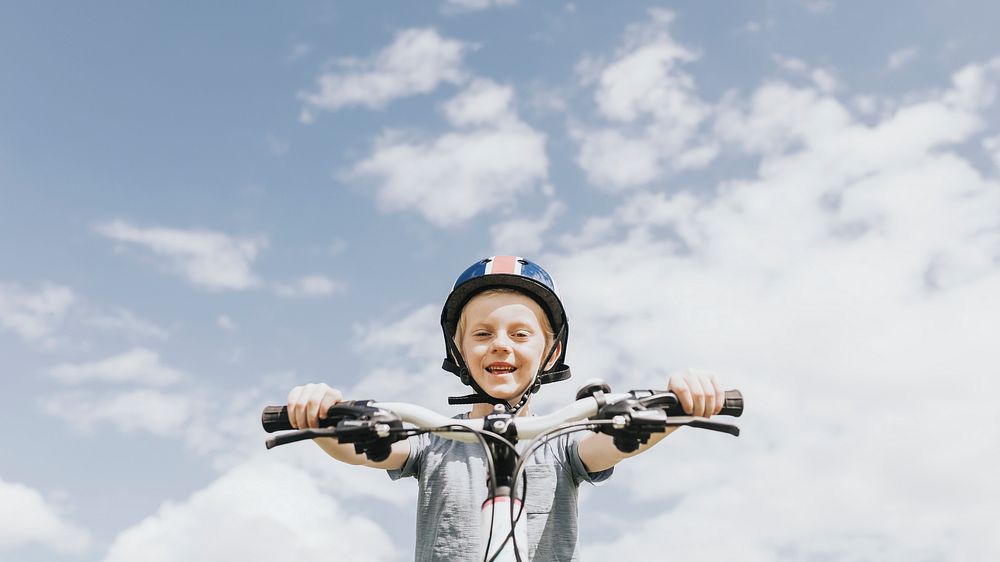 Kid desktop wallpaper, boy riding a bike, summer hobby