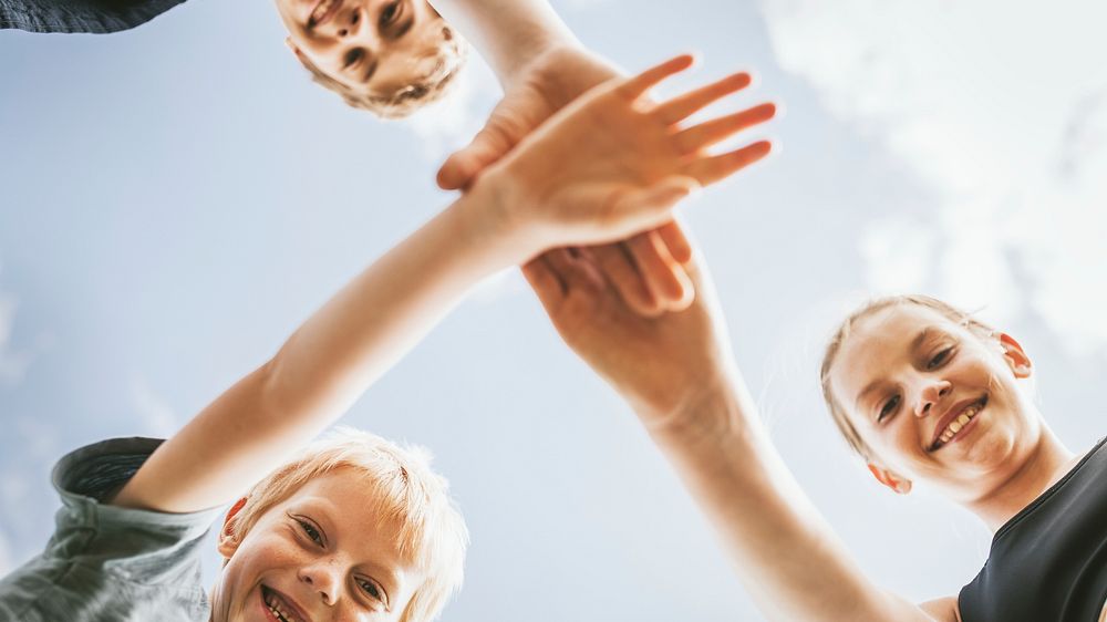 Teamwork wallpaper, kids stacking hands in the middle, family photo