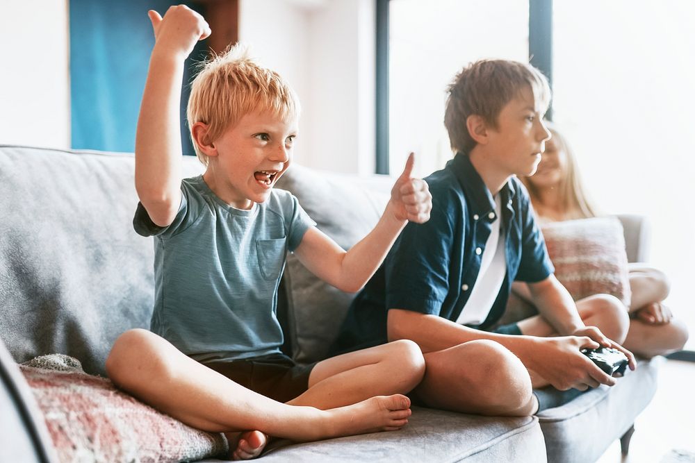 Boy playing video game in living room