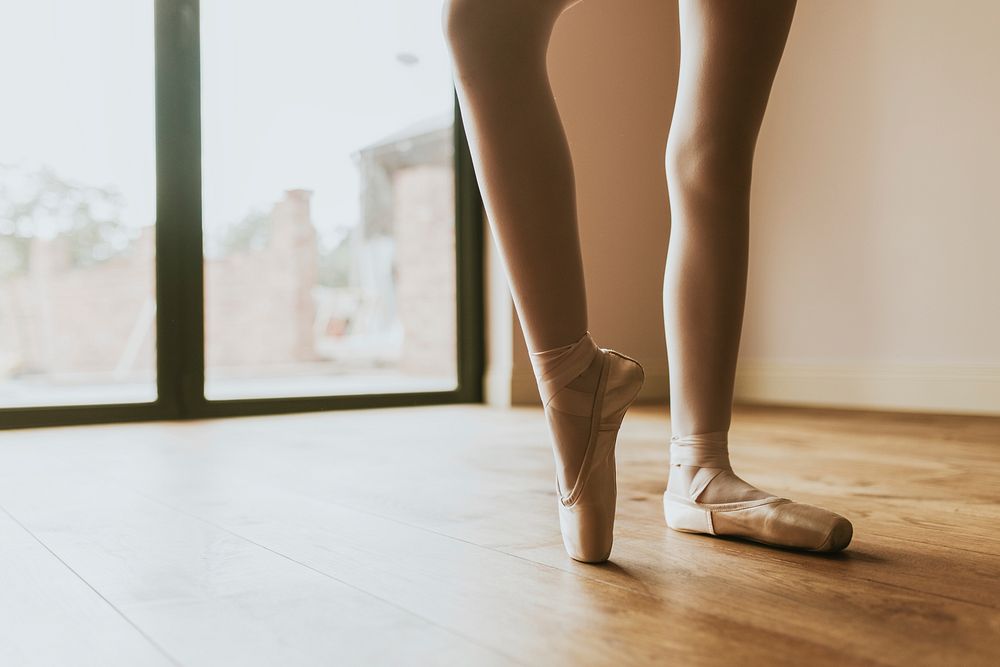 Ballerina background, releve pose, wooden floor