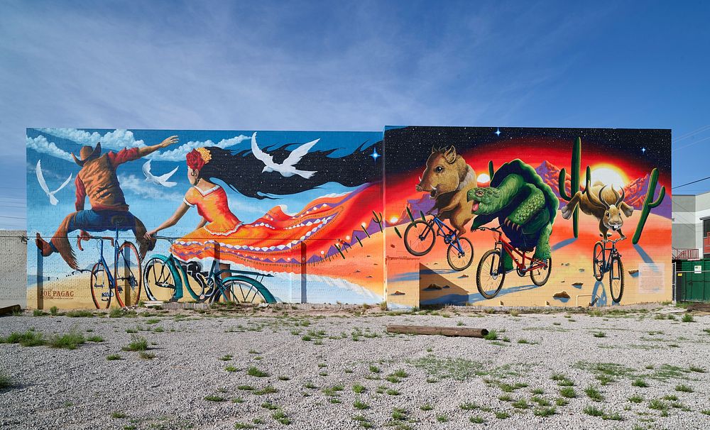 &ldquo;Epic Rides&rdquo; is one of several vivid murals created by artist Joe Pagac in Tucson, Arionza, a city of great…