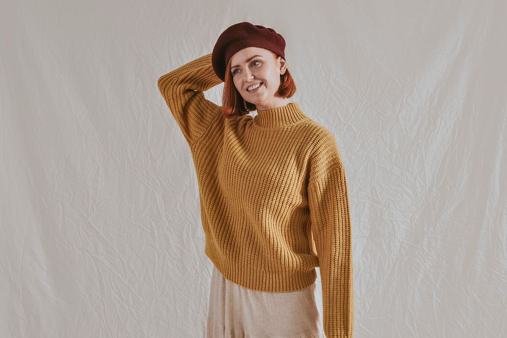 Cheerful woman in mustard yellow sweater, autumn apparel fashion design