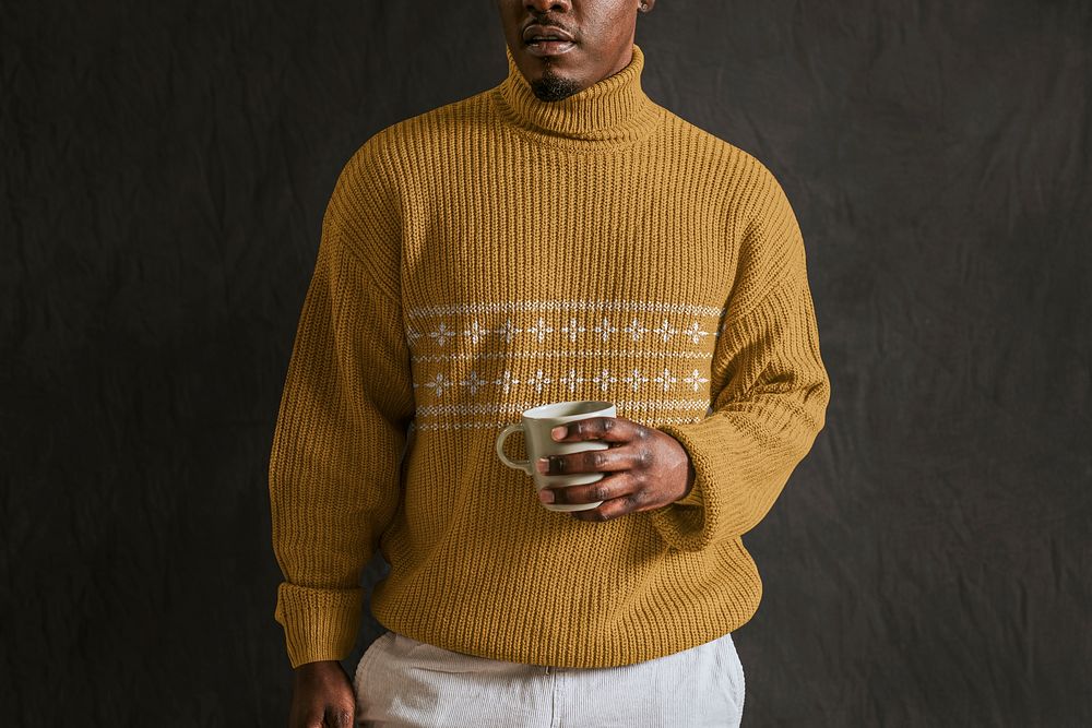 Man in mustard yellow turtleneck sweater, holding cup, autumn apparel fashion design
