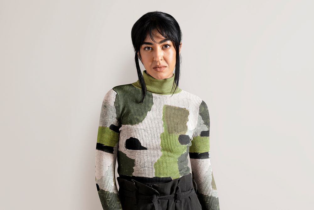 Woman in camouflage turtleneck sweater, autumn apparel fashion design