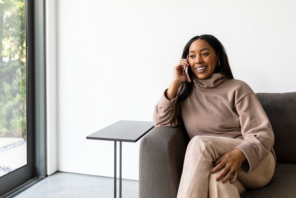 Woman talking on the phone in modern home