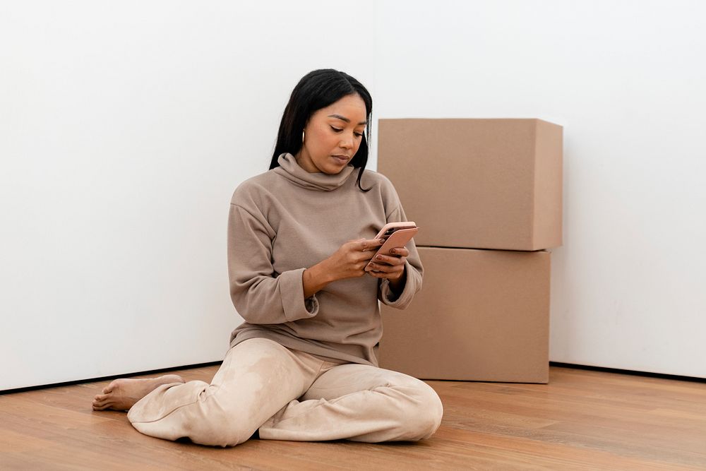 African American woman moving into new apartment