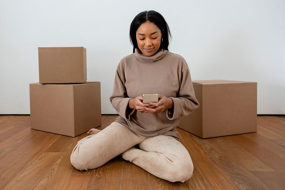 African American woman moving into new apartment