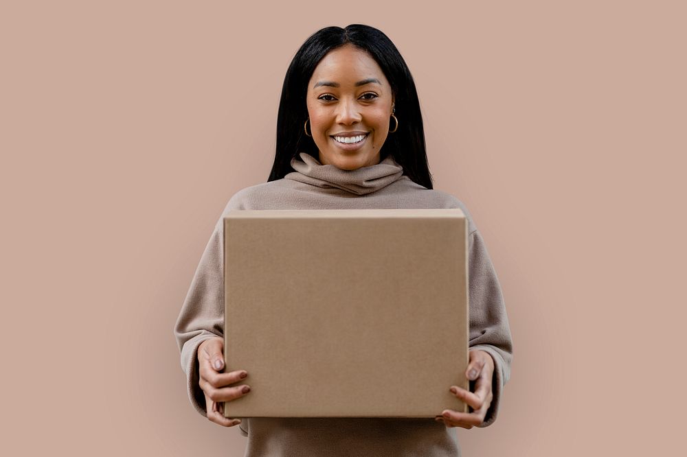 African American woman holding paper box psd