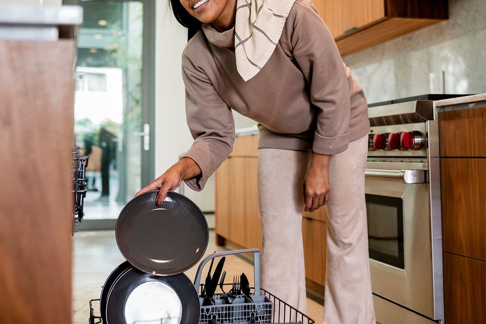 Putting dirty dishes into dishwasher, home chores