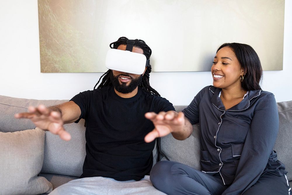 Couple entertained with VR goggles
