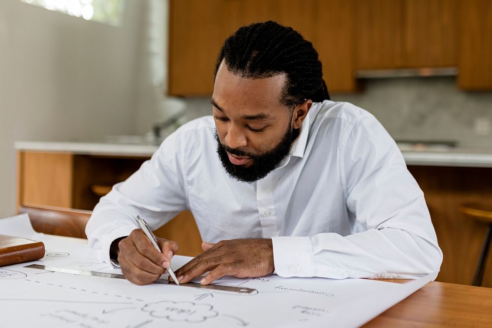 Businessman drawing a startup plan