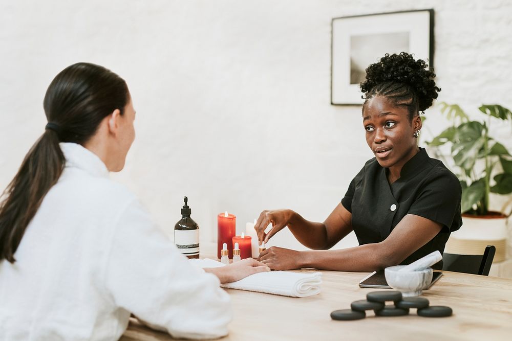 Esthetician giving advice to customer