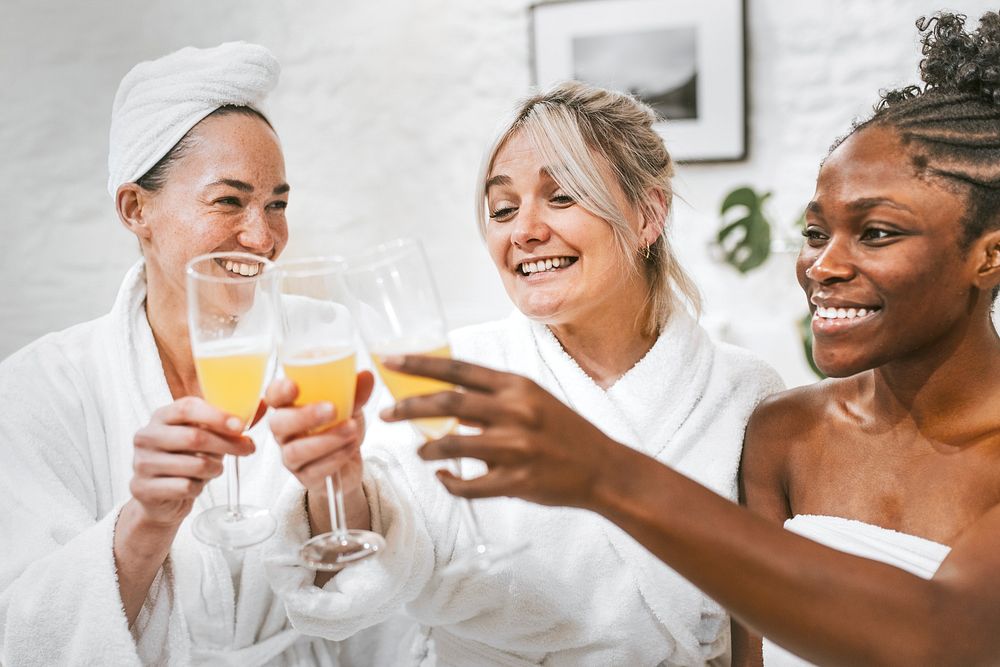 Women in bathrobe drinking, friendship photography