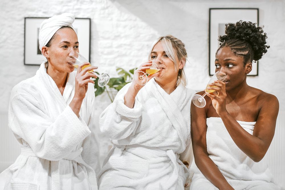 Friends in spa salon drinking, self-care photography