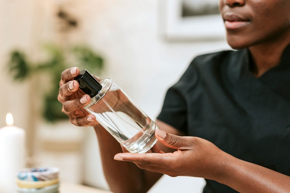 Female holding perfume bottle, massage & beauty design