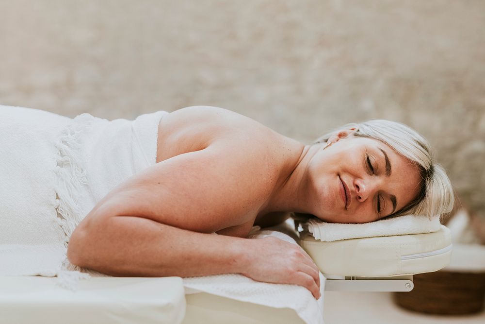 Woman getting massage in spa, health & wellness photo