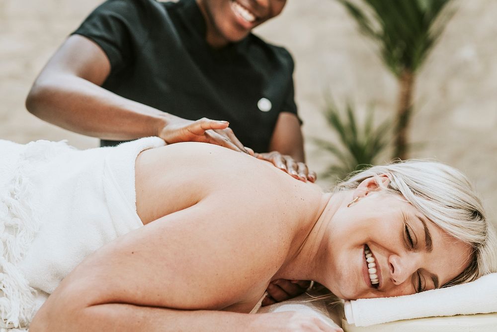 Woman enjoying back massage therapy, self-care concept