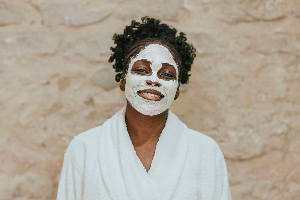 African American woman in spa facial mask