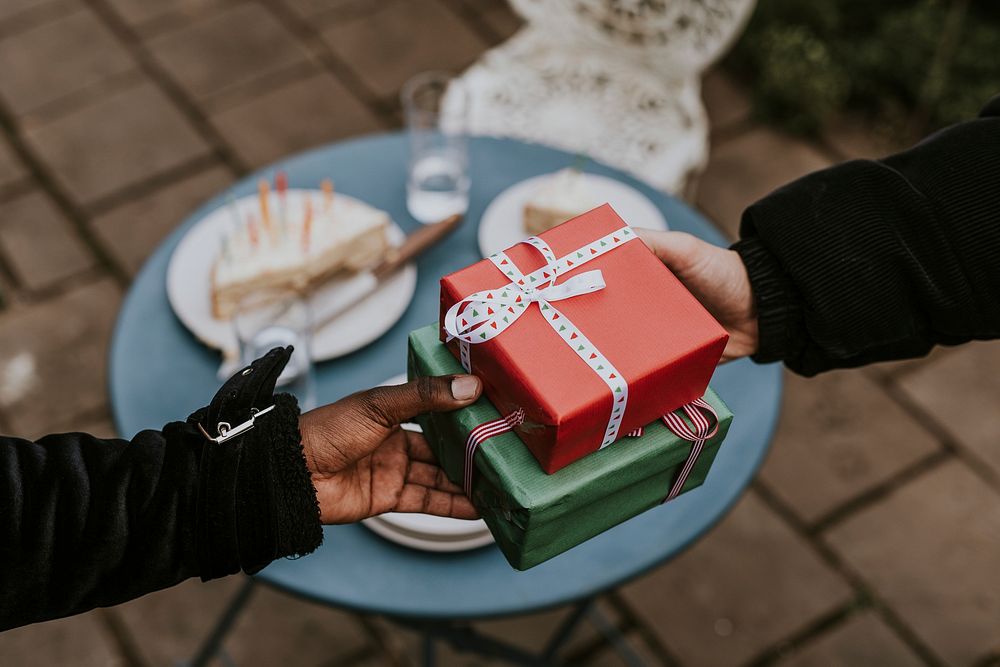 Friends exchanging gifts at a Christmas party 