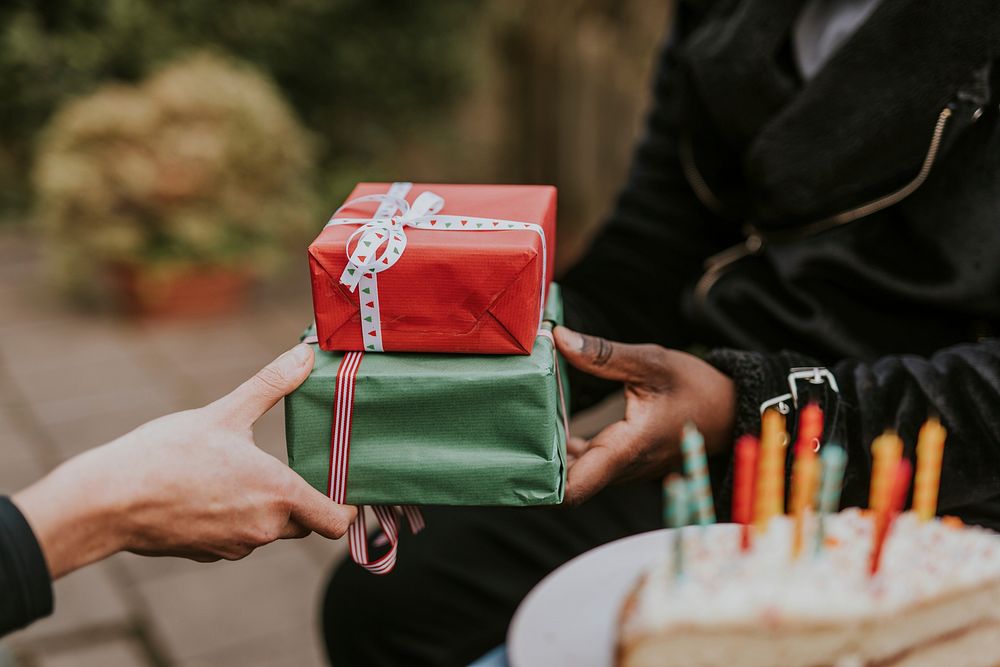 Friends giving gifts at a birthday party 