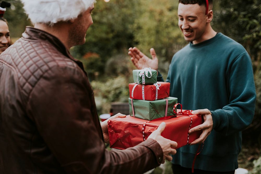 Friends exchanging Christmas gifts