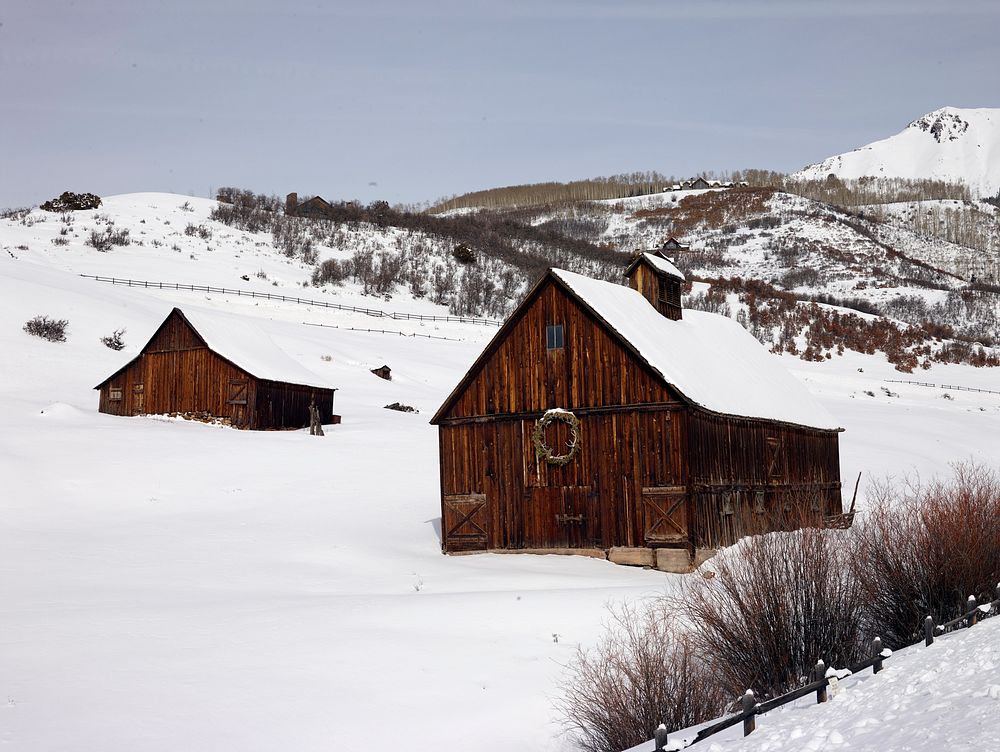 Cabins laden with heavy snow outside Telluride in San Miguel County, Colorado. Original image from Carol M.…