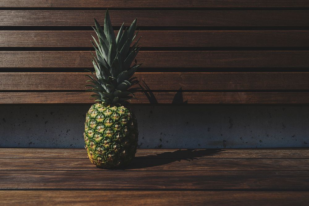 Tropical pineapple on a wooden deck