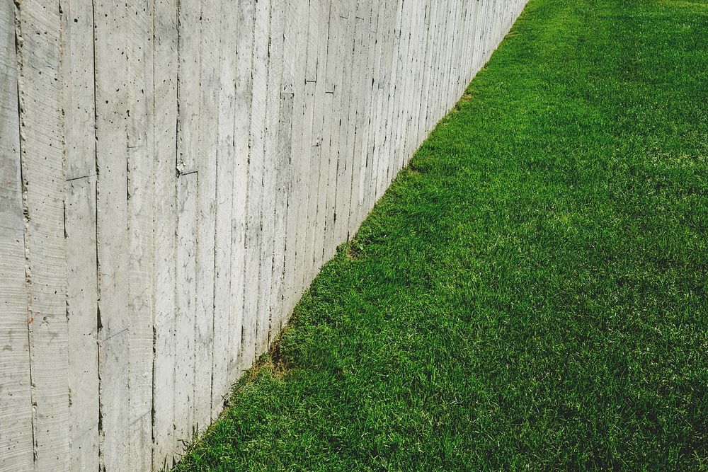Concrete fence and grass wallpaper