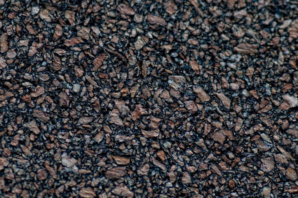 Close up dark asphalt background