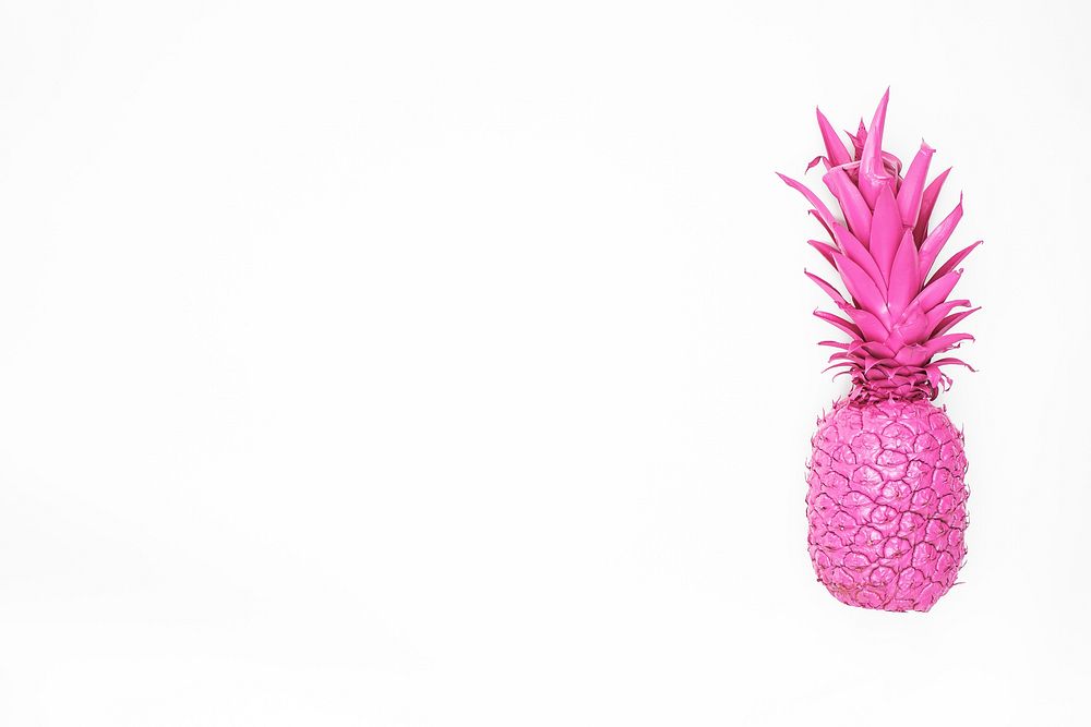 Pink pineapple isolated on white background