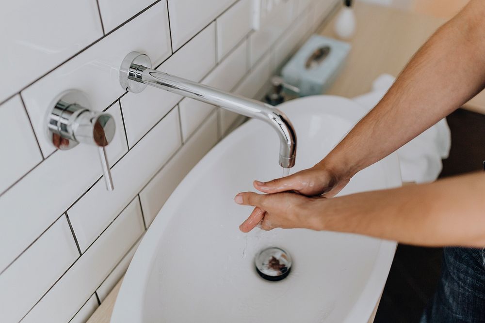 Man washing his hands. Visit Kaboompics for more free images.