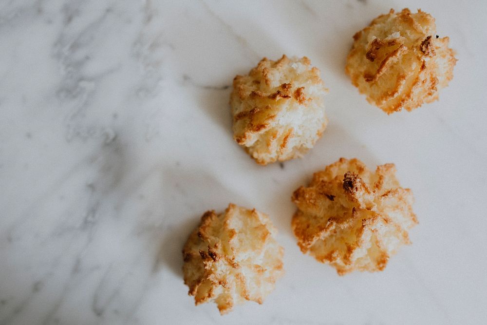Four coconut macaroons. Visit Kaboompics for more free images.