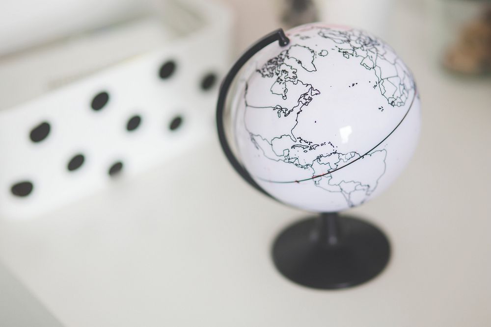 White globe on a table. Visit Kaboompics for more free images.