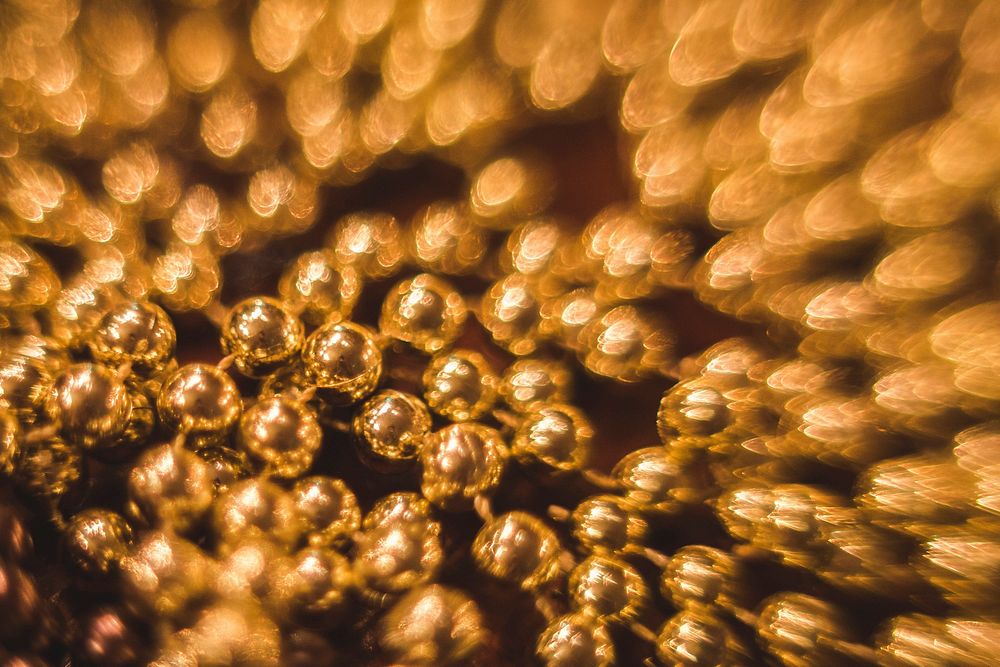 Close up of golden pearls. Visit Kaboompics for more free images.