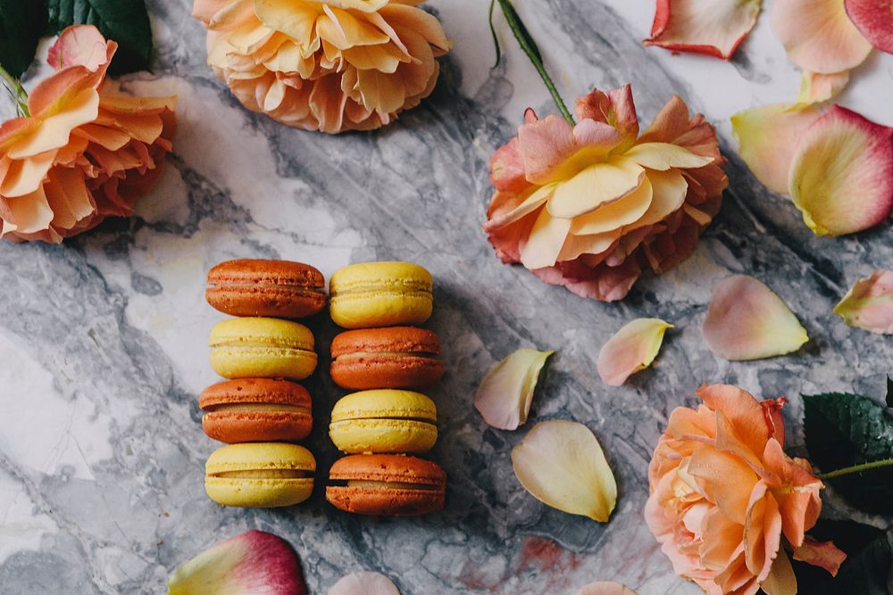 Orange and yellow macaroons. Visit Kaboompics for more free images.